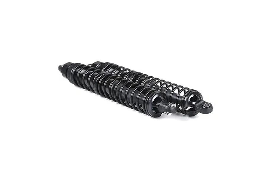 Two black aluminium front shock absorbers laid horizontally on a plain white background.