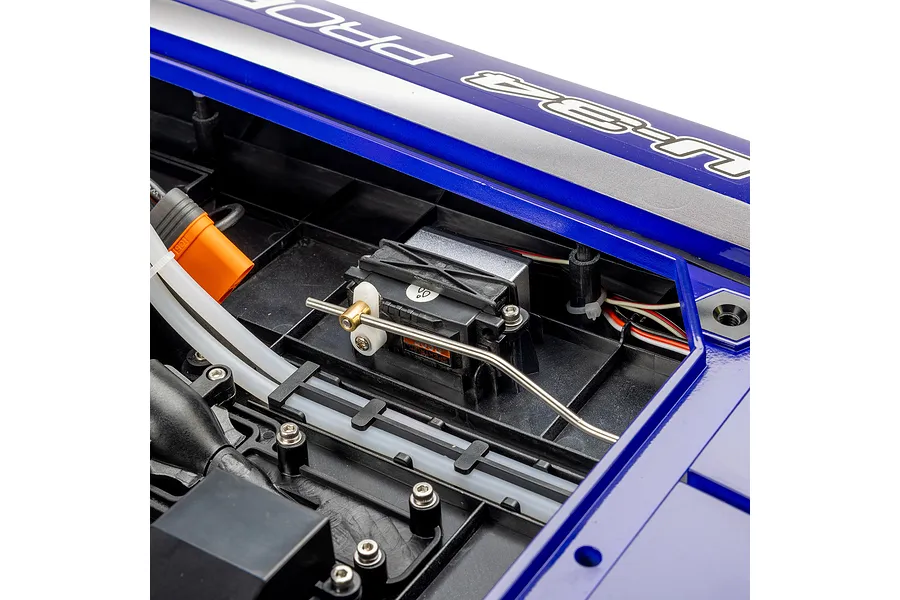 Close-up of the internal electronics compartment of the Pro Boat Miss Illinois U-34 RC boat, showing the steering servo and linkage.