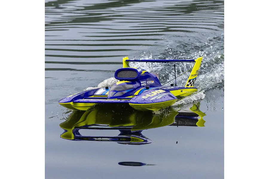 Pro Boat Miss Illinois U-34 RC boat running on water, creating a wake and reflecting on the surface.