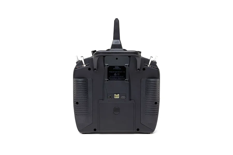Rear view of Spektrum NX8+ 20ch DSMX transmitter showing the battery compartment, ports, and antenna against a white background.