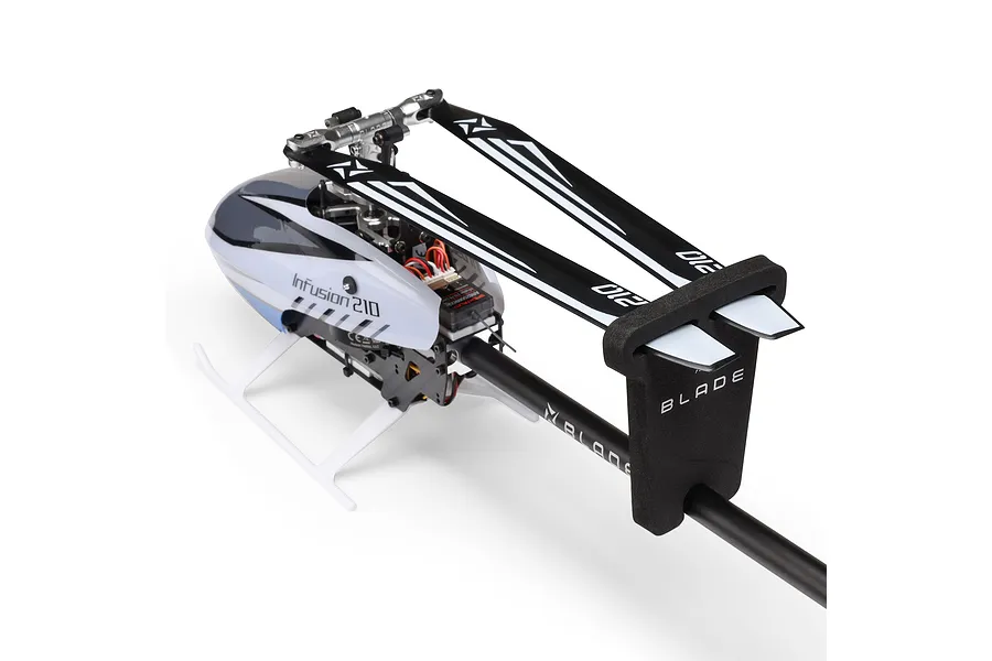 Studio product view of the Blade InFusion 210 RC helicopter with main blades secured in a foam holder against a plain white background.