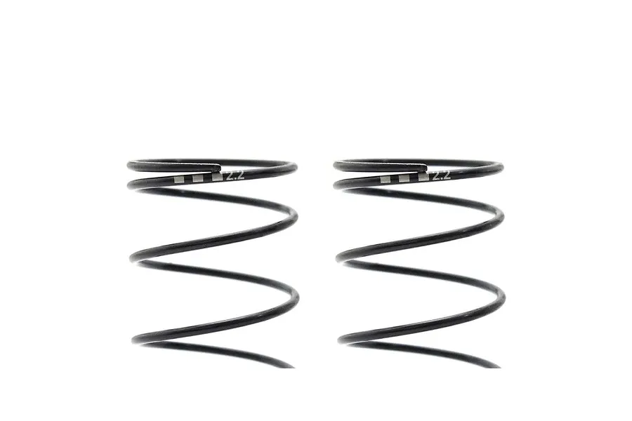 Close-up studio view of two black Kyosho 63mm big bore RC shock springs against a white background.