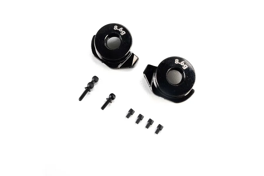 Axial brass weighted 8.6g steering hubs with included hardware set against a plain white background.