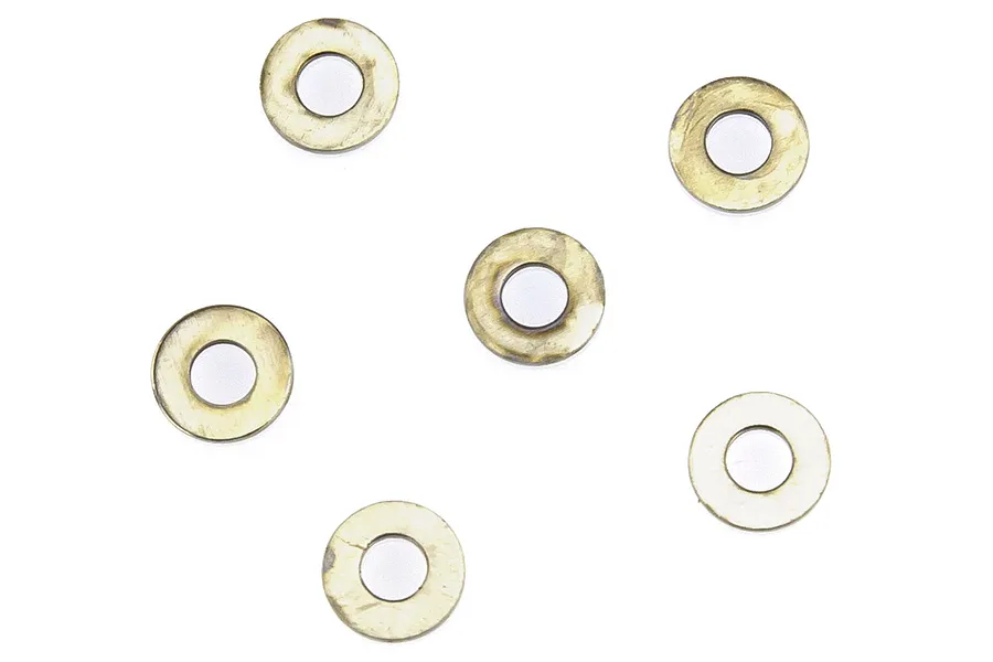 Six small circular metal washers arranged on a plain white background.