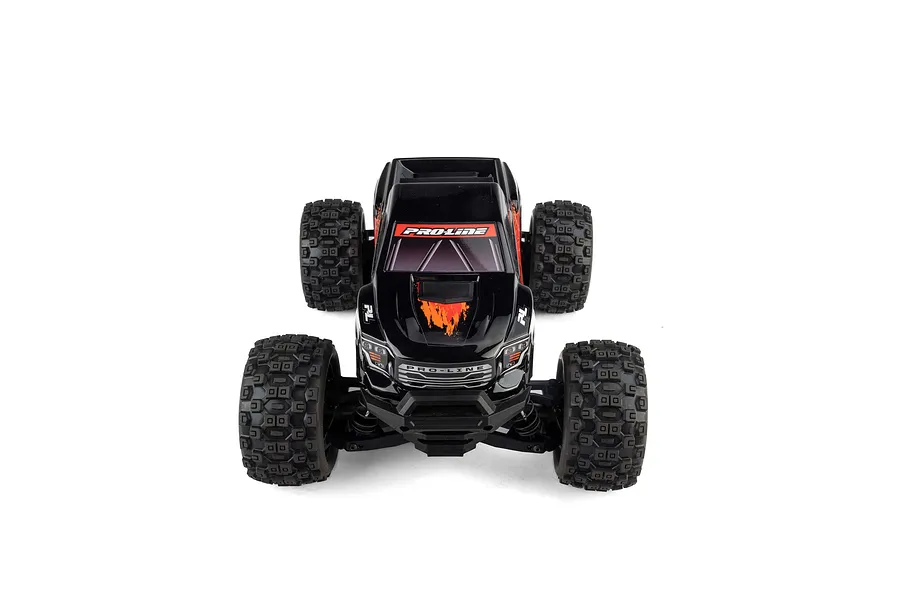 Front view of an RC monster truck fitted with a black Pro-Line Brute painted body shell on a white background.