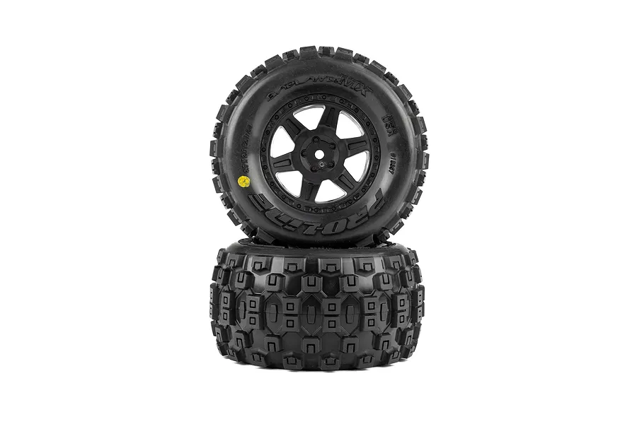 Pro-Line Badlands MX tyres mounted on black Desperado rims, stacked vertically against a pure white background.