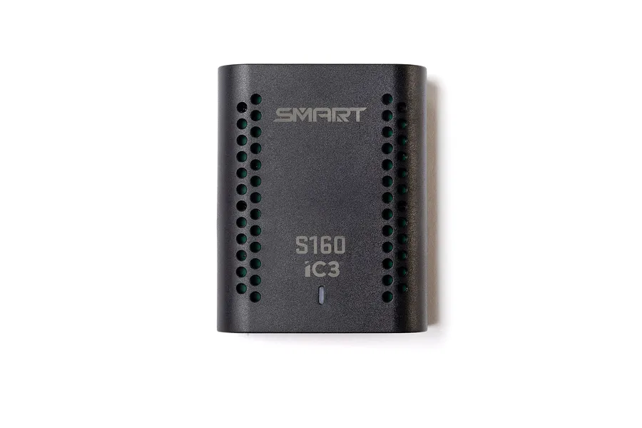 Spektrum S160 smart charger shown from the top, featuring a black plastic housing with cooling vent holes and printed branding.