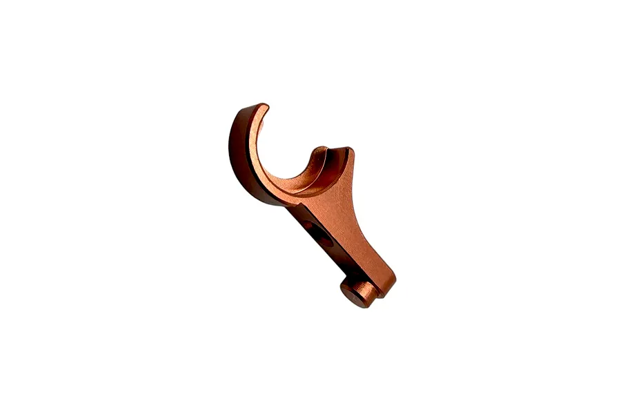 RC Maker anti-roll bar holder in orange anodised aluminium on a plain white background.