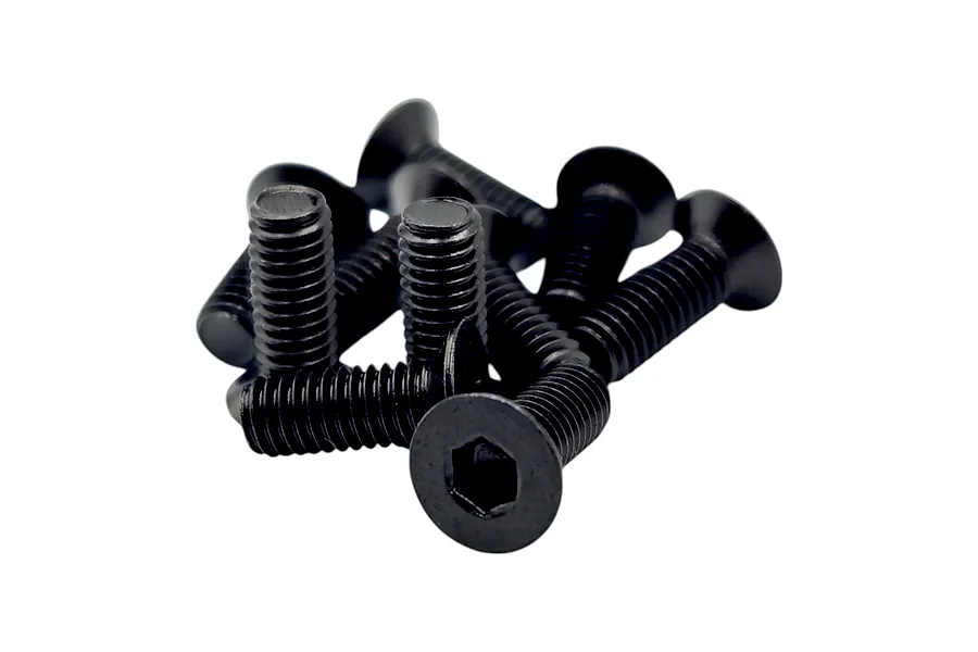 A pile of black countersunk socket head screws against a solid white background.