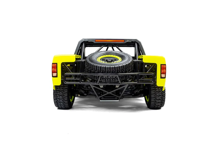 Rear view of the Losi 5IVE-T 1/5 scale short course truck showing the spare tire and roll cage against a white background.