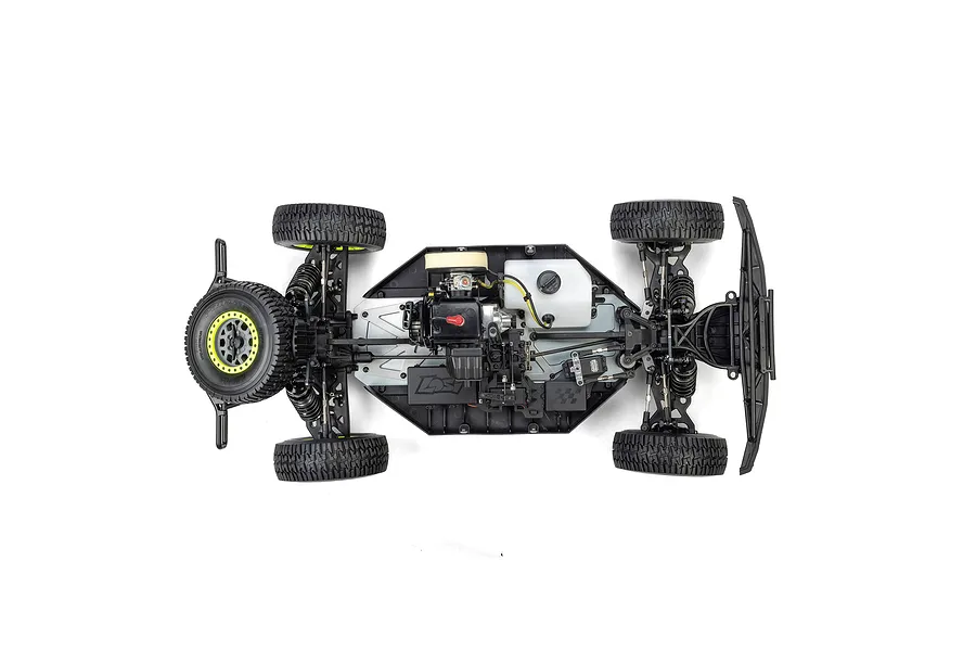 Top-down studio view of the Losi 5IVE-TG 3.0 RC truck chassis showing internal petrol engine, fuel tank, and suspension components.