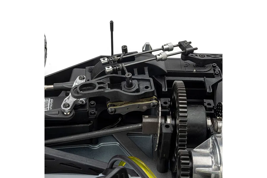 Close-up studio view of the internal chassis layout, linkages, and gear assembly of the Losi 1/5 scale RC vehicle.