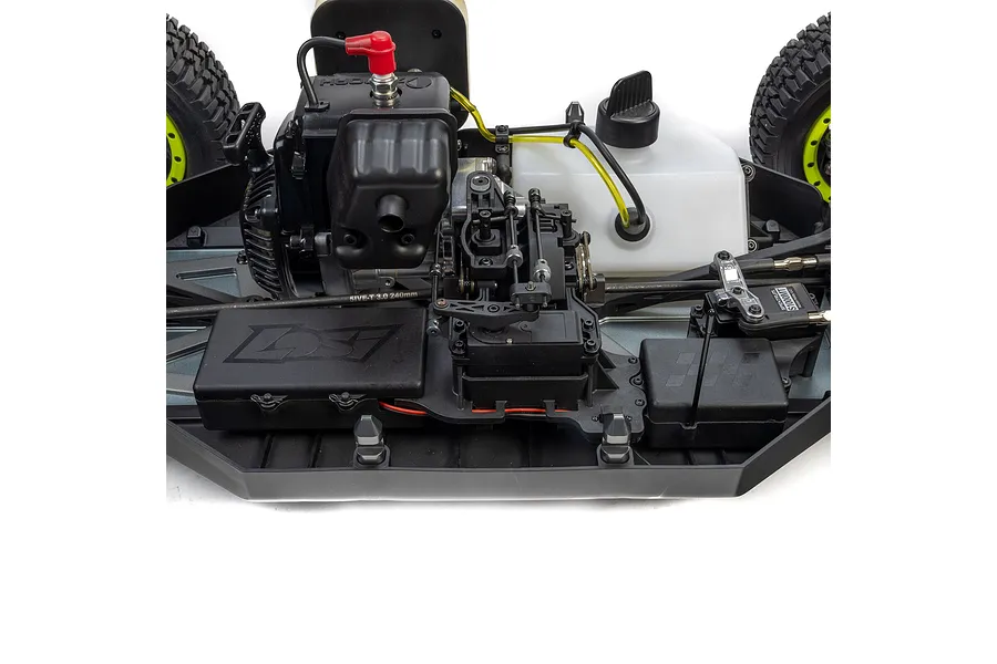 Close-up studio view of the internal chassis, petrol engine, fuel tank, and steering servo of the Losi 1/5 5IVE-TG 3.0 RC short course truck.
