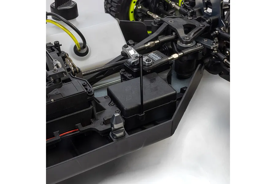 Close-up studio view of the chassis layout and radio box on the Losi 1/5 5IVE-TG 3.0 petrol short course truck.