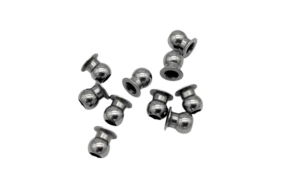 Ten polished metal female ball studs scattered on a plain white background.