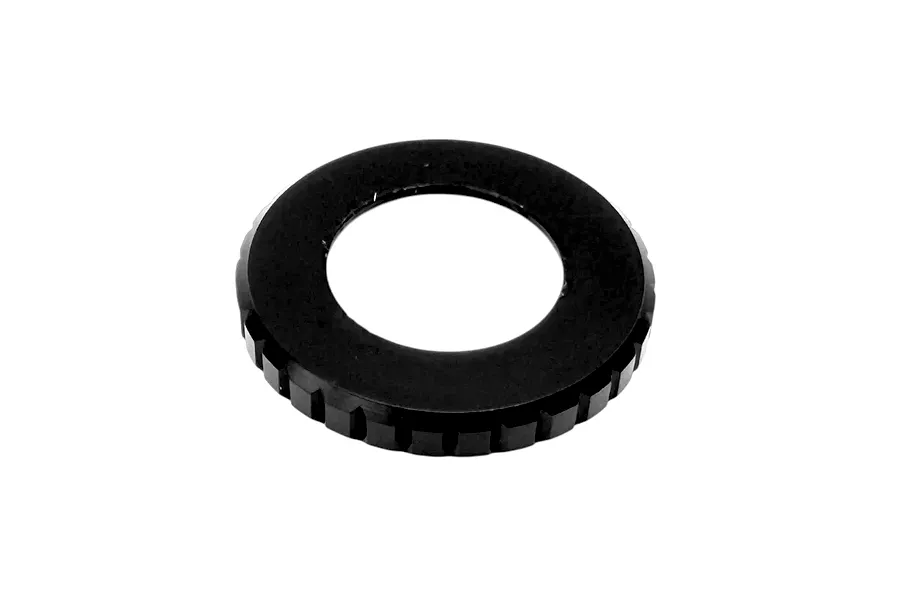 RC Maker black metal shock top cap ring with outer serrated edges on a plain white background.
