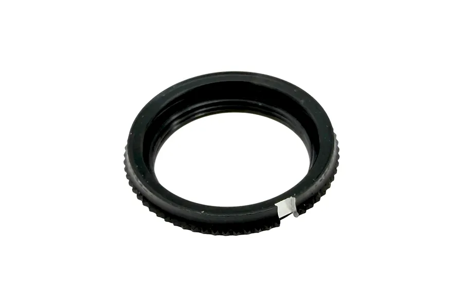 A black threaded RC shock collar resting on a clean white background, viewed from an angled top-down perspective.