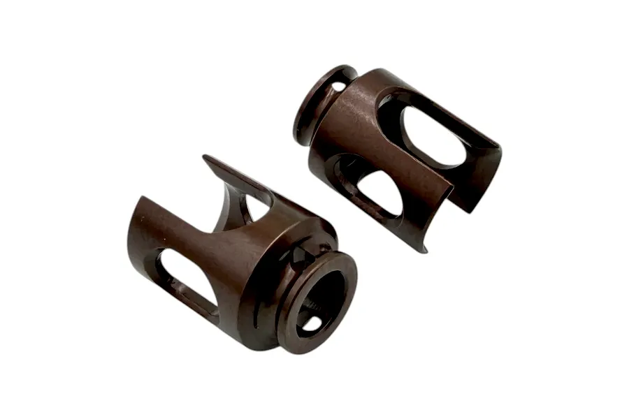Two dark bronze colored metal RC differential outdrive cups displayed against a clean white background.