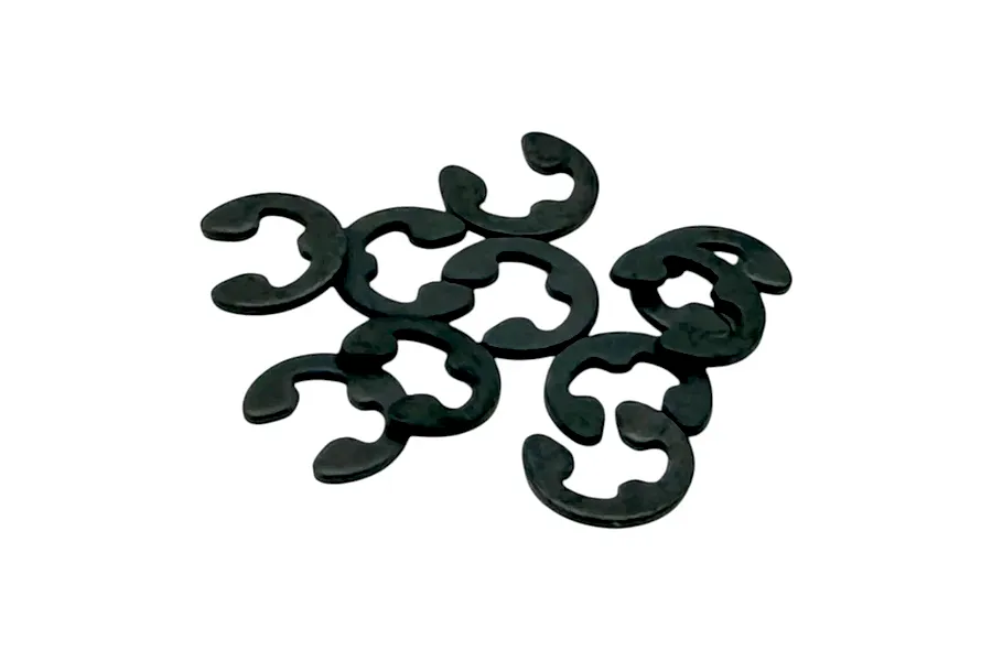 A small pile of dark metal E-clips and retaining clips against a clean white background.