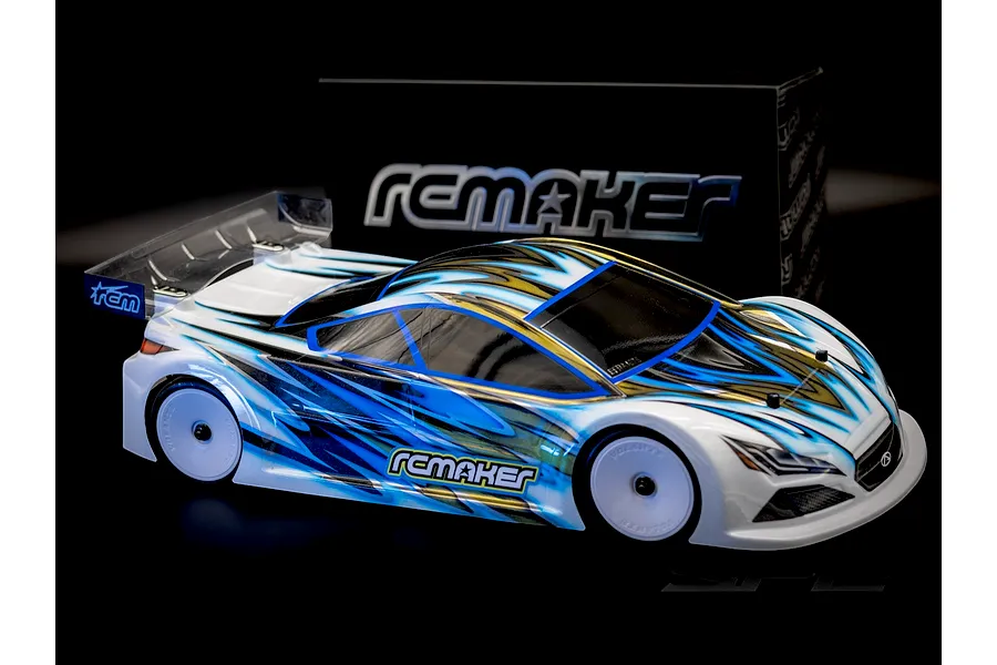 RC Maker SP2 EP RC Touring Car 1/10 scale kit with custom blue, black, and white painted body shell and box in background.