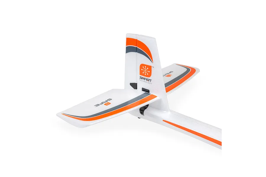 Close-up studio view of the white foam tail section, vertical stabilizer, and horizontal stabilisers of the HobbyZone AeroScout S 2 RC plane with orange and grey decals.