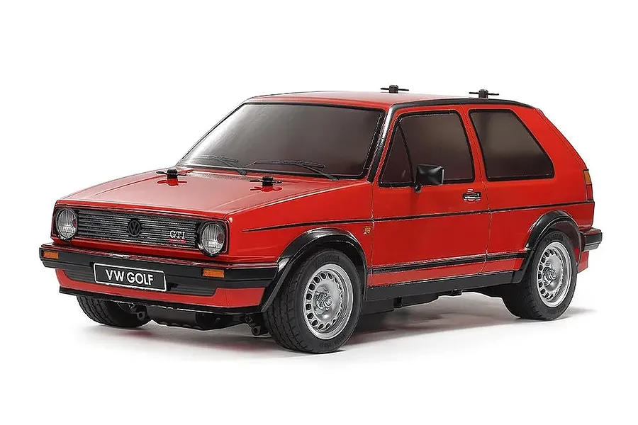 Studio product shot of Tamiya MB-01 Volkswagen Golf II GTI 16V RC car in red with silver wheels against a white background.