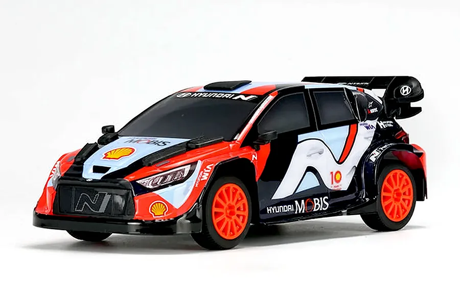 Studio product shot of the Carisma Hyundai i20N Rally1 RC rally car in 1/24 scale with official livery against a plain white background.