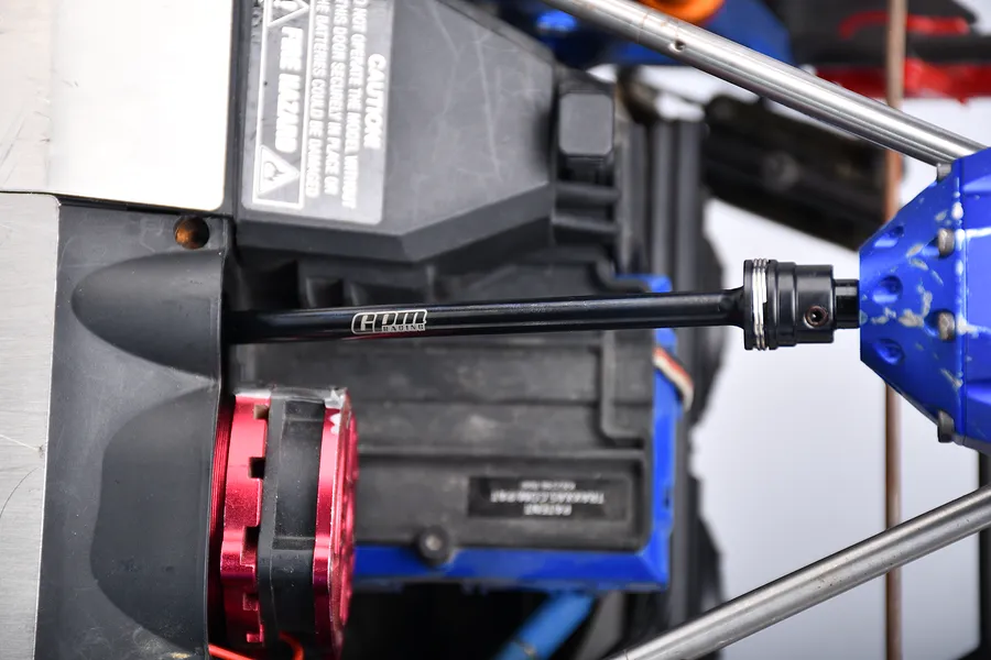 Installed GPM black carbon steel rear centre CVD driveshaft on an RC chassis with visible GPM branding.