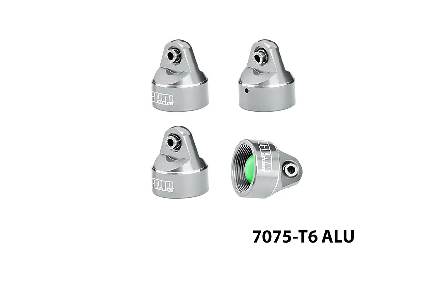 Four silver aluminium RC shock caps shown from different angles with internal threading and branding visible.