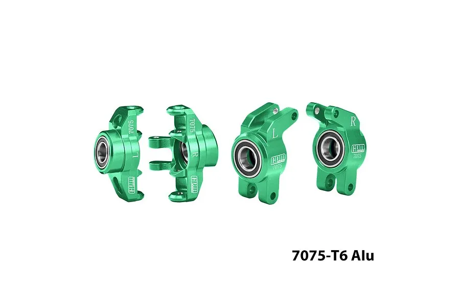 Green anodized aluminium steering and rear hubs set with pre-installed bearings for RC cars against a white background.