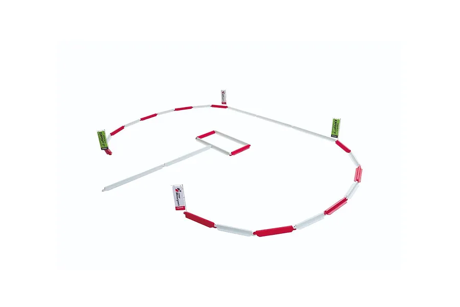 Kyosho Circuit Fence Set arranged in a circuit layout with red and white barriers and flags on a white background.