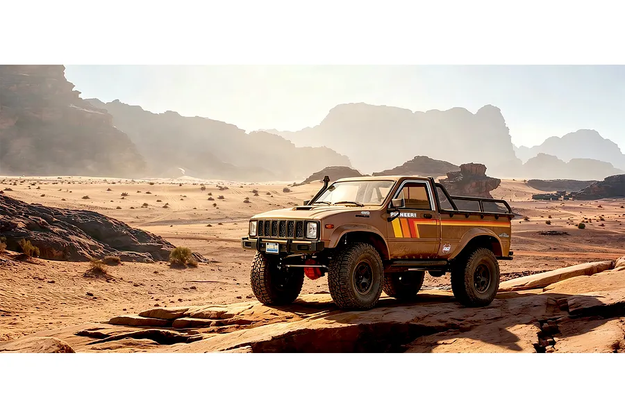 RGT Pioneer V2 Pro 1/10 scale RC rock crawler truck driving on a rocky desert landscape.
