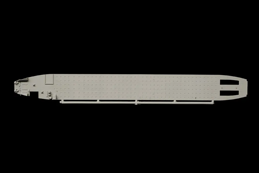 Grey plastic model kit sprue part showing a flat structural deck or floor against a black background.