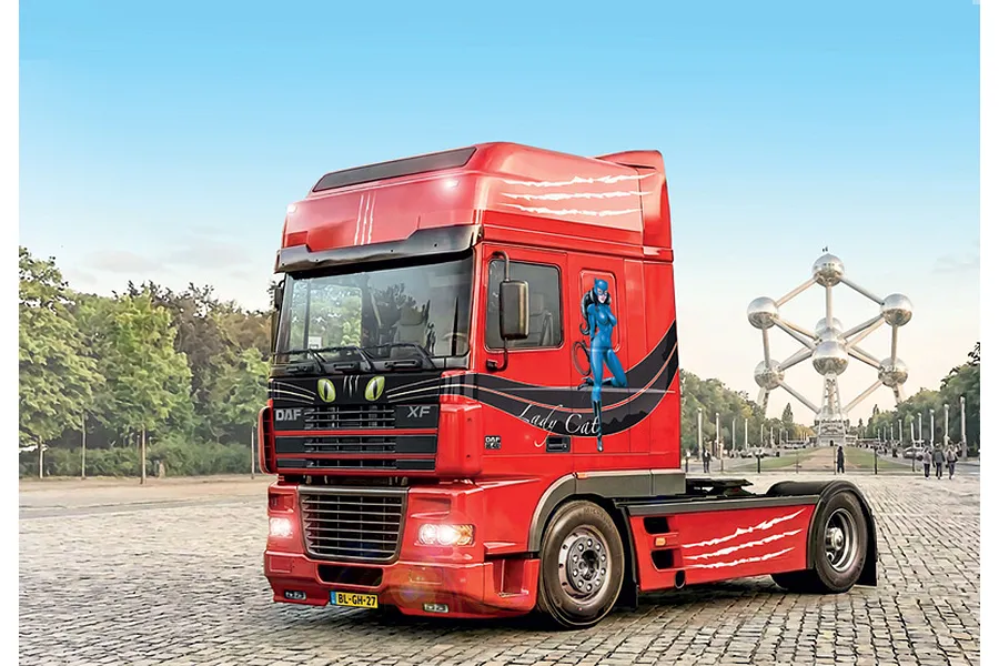 A completed and painted 1/24 scale Italeri DAF XF 95 Super Space Cab semi truck model featuring Lady Cat graphics parked on a cobblestone plaza.