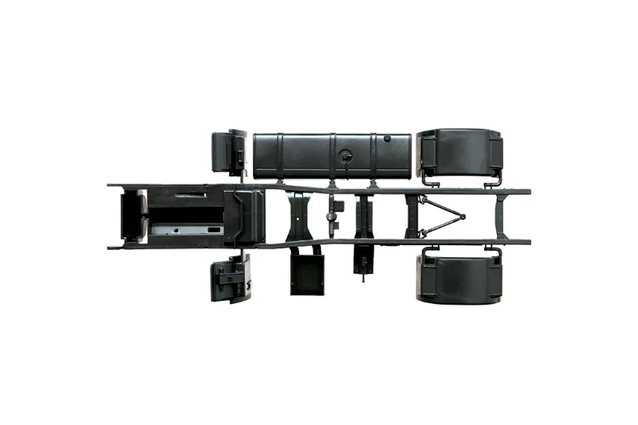 Top-down studio view of a black plastic semi truck scale model chassis assembly against a white background.