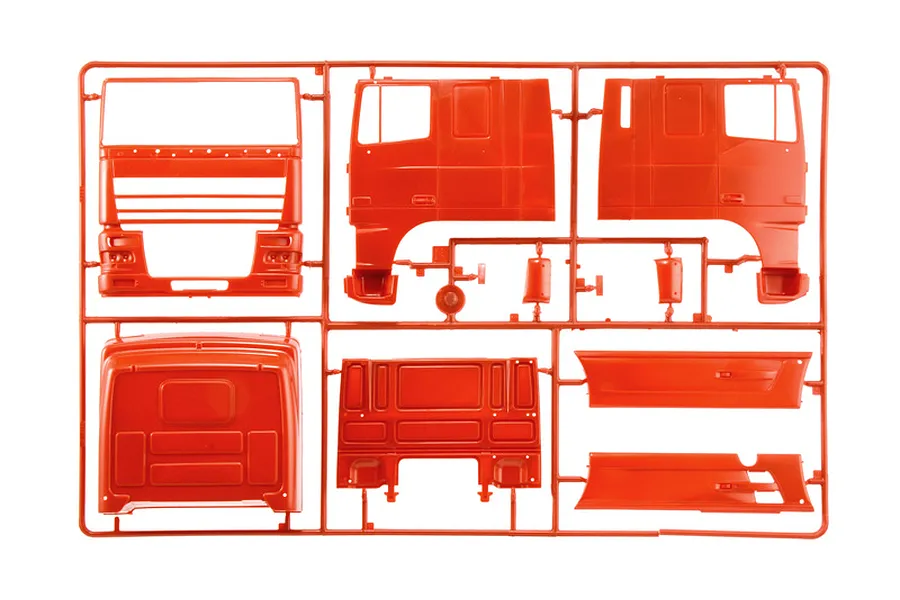 Red plastic model kit sprue containing truck cab body parts and side panels for a 1/24 scale model