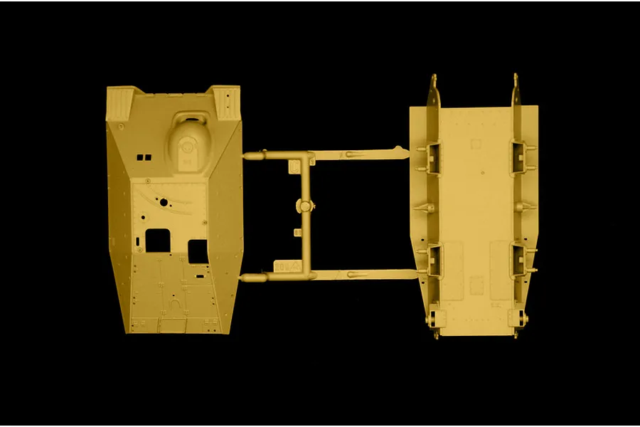 Top-down studio view of plastic model kit parts showing a tank hull and upper body on a sprue against a black background.