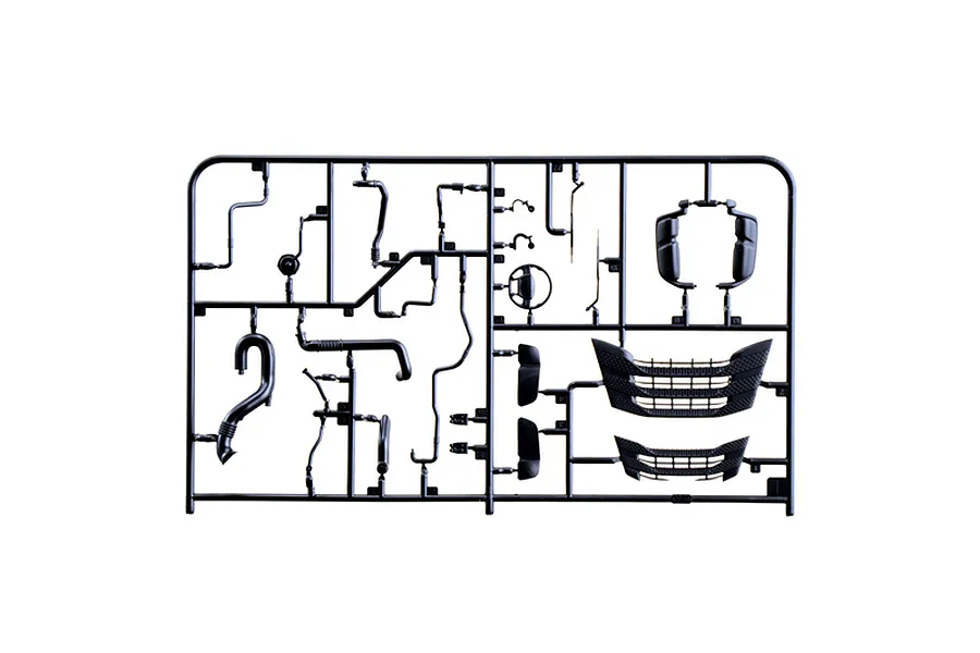 Black plastic model kit sprue containing various truck parts, mirrors, grille pieces, and pipes on a plain white background.