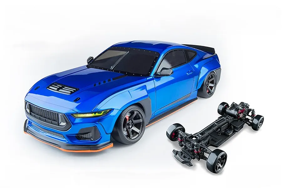 MST MTRTR 275 RC drift car in metallic blue with wide body styling, shown alongside its black chassis against a white background.