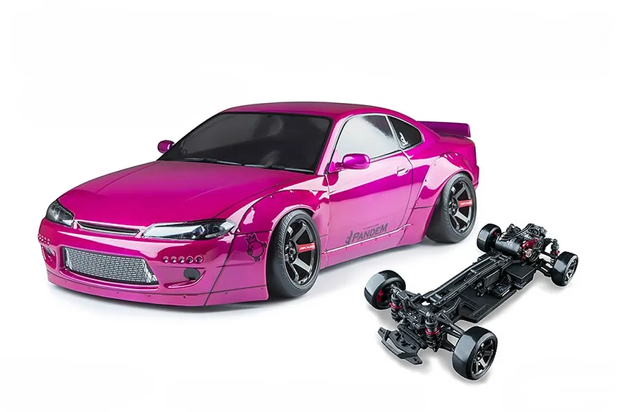 Studio product shot of an MST S15RB magenta RC drift car body paired with a separate black chassis on a white background.