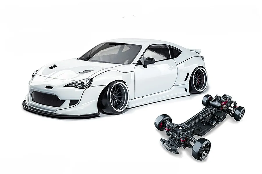 MST 86RB white RC drift car body with wide body kit alongside its black chassis on a white background