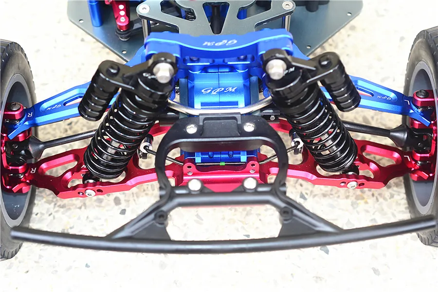 Front end of an RC car installed with blue, red, and black aluminum and steel upgrade parts.