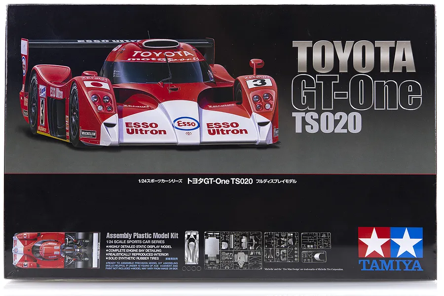 Product packaging for Tamiya 1/24 Toyota GT-One TS020 plastic model kit, featuring a red and white race car on a black background.