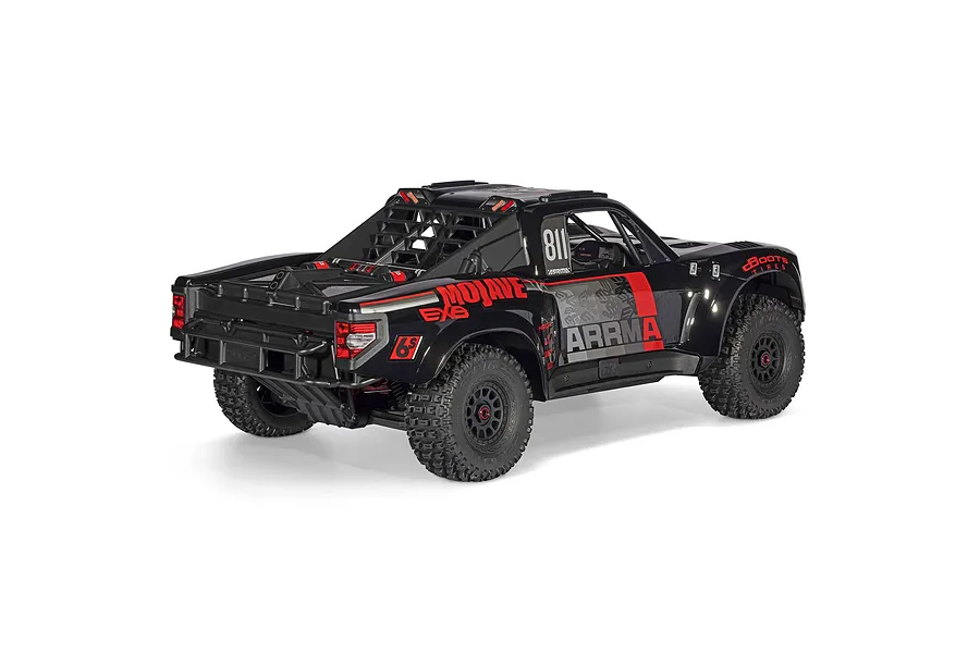 Rear three-quarter view of the ARRMA Mojave 6S EXB desert truck in black with red and grey livery on a white background.