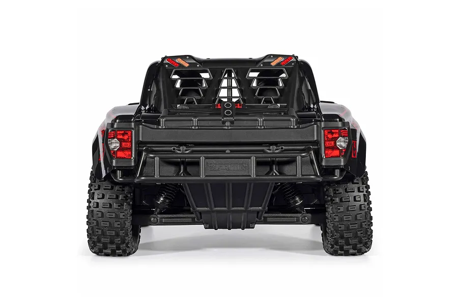 Rear view of the ARRMA MOJAVE 6S 1/7 EXB black RC desert truck showing rear bumper, taillights, and roll cage.