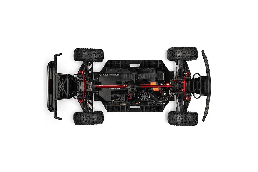 Top down studio view of the ARRMA Mojave 6S EXB chassis showing internal components, red accents, and tires on white background.