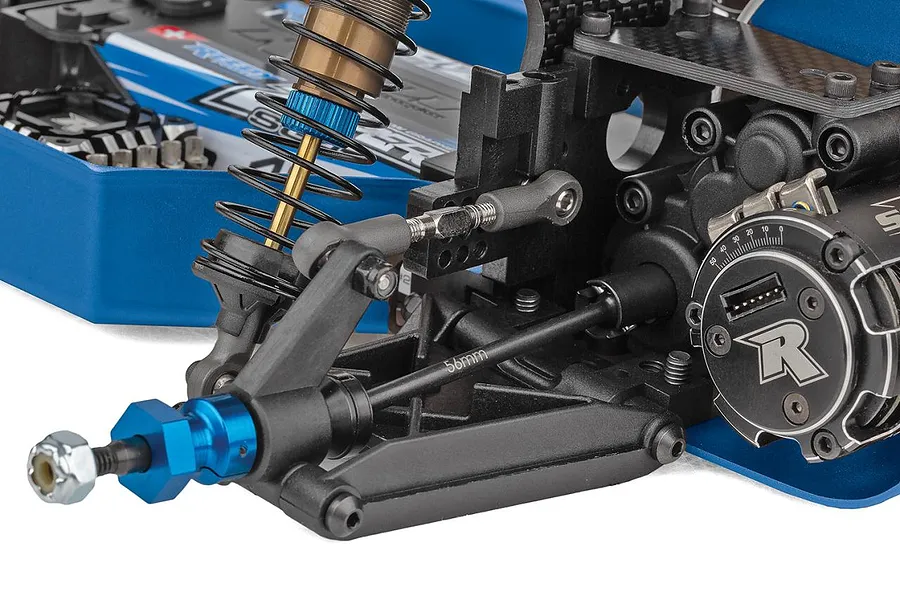 Close-up view of the front suspension and chassis components of the Team Associated RC10 Factory Team Blue Edition RC car.