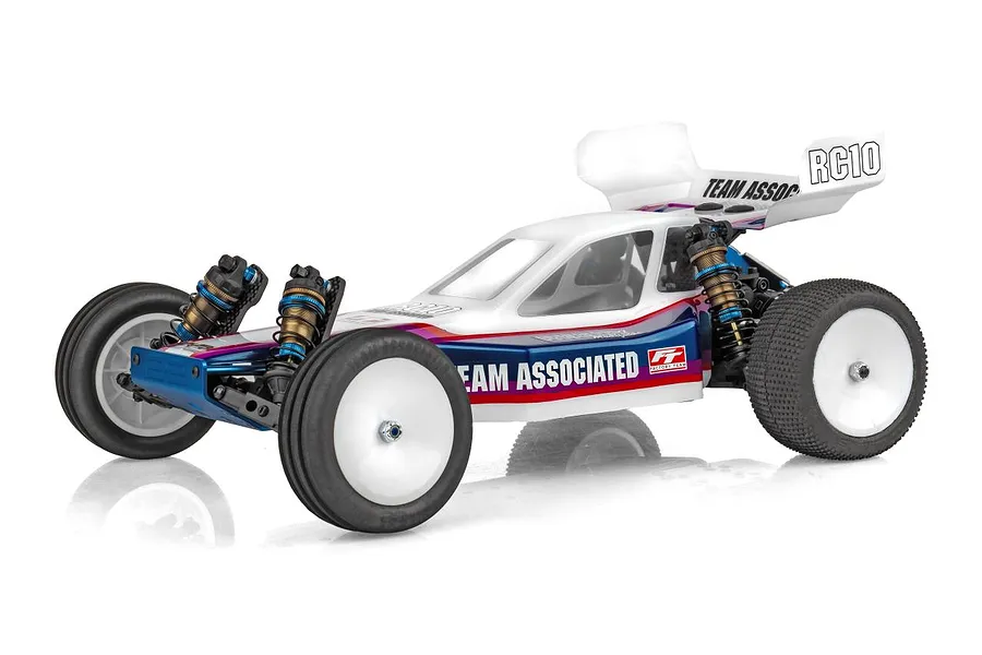 Studio shot of Team Associated RC10 Factory Team Blue Edition buggy on a white background with detailed blue and white body and shocks.