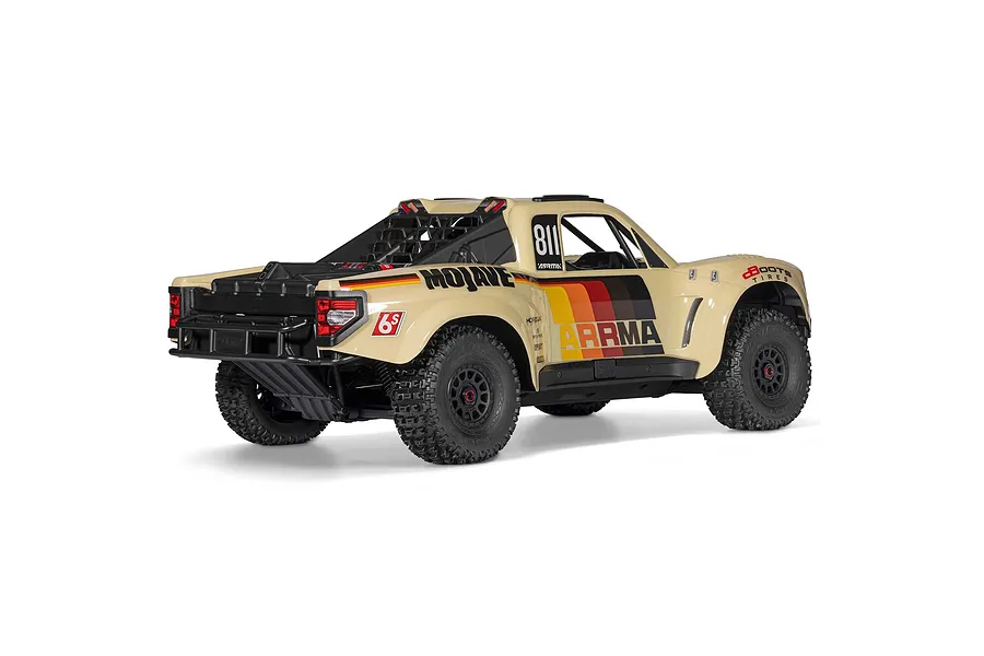 Rear-three-quarter studio shot of the ARRMA MOJAVE 6S RC short course truck in beige with retro stripes.