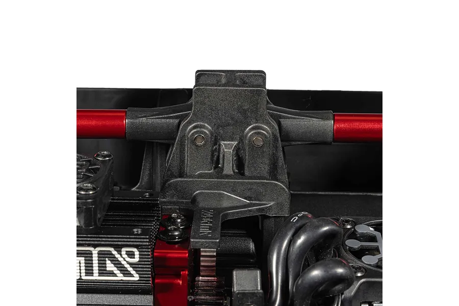 Close-up studio view of internal chassis components and red brace of the ARRMA MOJAVE 6S RC short course truck.